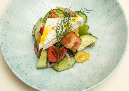 A plate with tomato, cucumber and feta from Elia